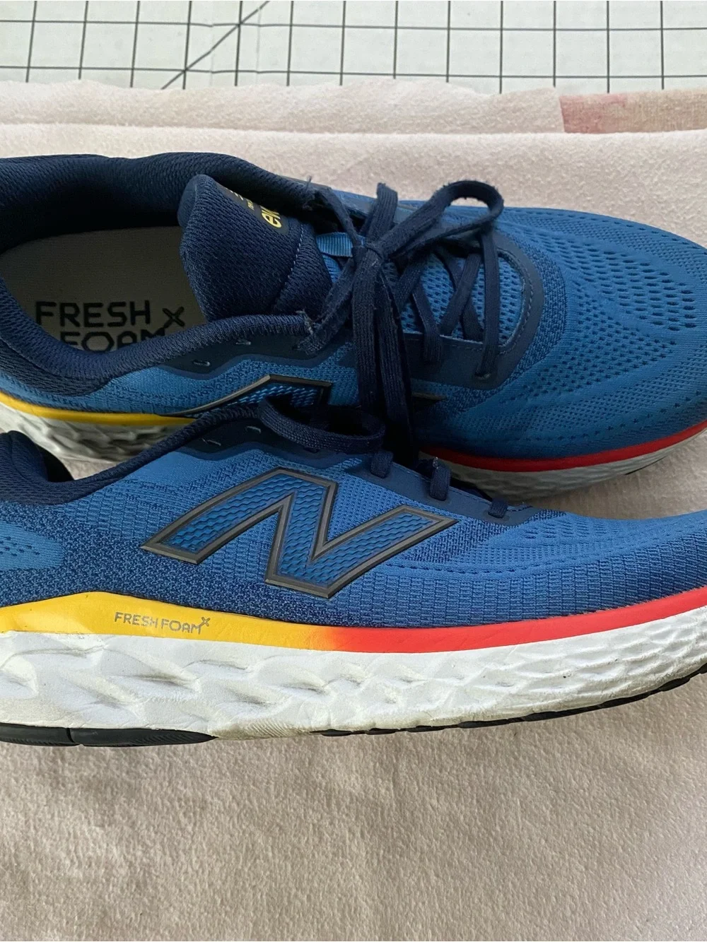 New Balance EvoZ Men's Blue and Navy Athletic Running Shoes with Red Accent